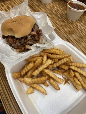 Brisket sandwich with fries.