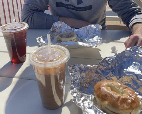 Iced coffee Iced caramel latte Bagel with cream cheese  Egg cheese and bacon sandwich