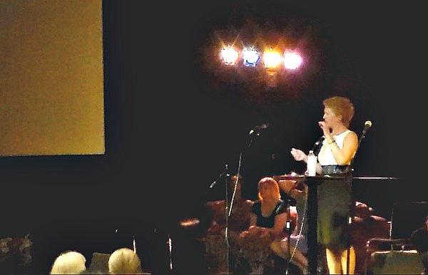 Suzanne Smith offering messages during a spiritualist service