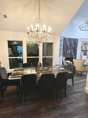 Amazing custom dining table made of beautiful wood. Stunning dining chairs in a crushed velvet. Another Ralph Lauren amazing chandelier.