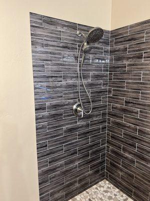 Gorgeous tile work in a new bathroom shower.