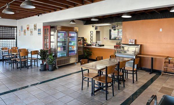 inside restaurant with fridge stocked with canned and bottled drinks