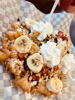 Build your own funnel cake...cookies and cream ice cream, strawberries, banana, chocolate sauce, peanuts and whipped cream.