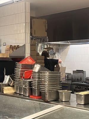 Empty stacked up containers left on counter