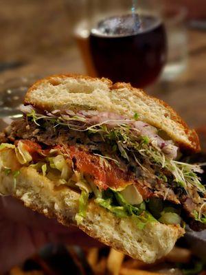 Inside the house-made veggie burger (minus cheese & sauce to make it vegan). Tasty patty, but a plant-based sauce would make it better.