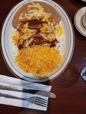 Shredded beef burritos, rice and beans.