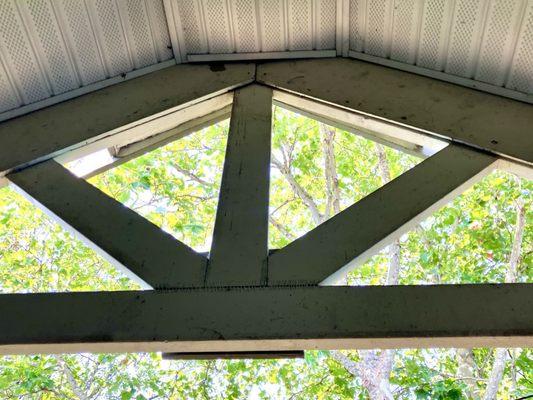 The truss creaks and moves when it's windy. Vinyl siding, OSB, and staples -- maybe OK for a shed, not a residence