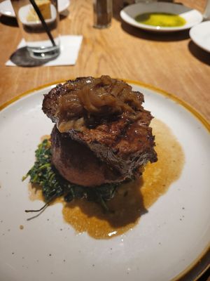 Filet mignon over mashed potatoes and spinach