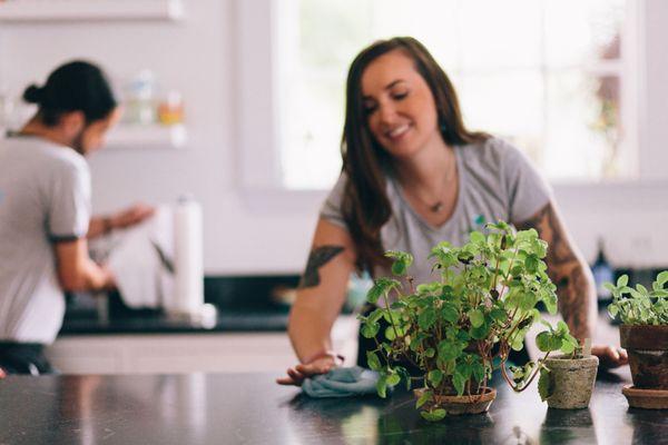 Polishing the kitchen island at a routine home cleaning - no harsh chemicals, just super-effective, non-toxic cleaning formulas.