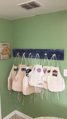 These are some of our adult and kids aprons that we design and make at the farm.