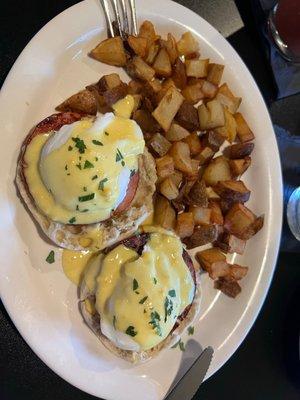 Eggs Benedict with home fries.