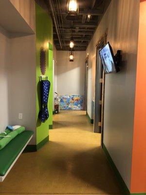 Hallway to Treatment Rooms with Sitting Area and TV