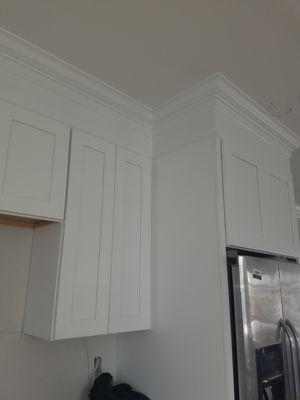 you can see a tall end panel we added , so you cannot see the fridge side anymore, and its a better looking on your kitchen