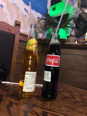 Bottle coke and banana soda.