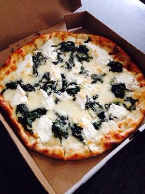 White personal pie with spinach and garlic