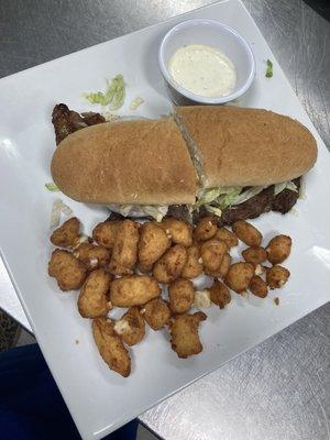 Ribeye steak sandwich and cheese curds.