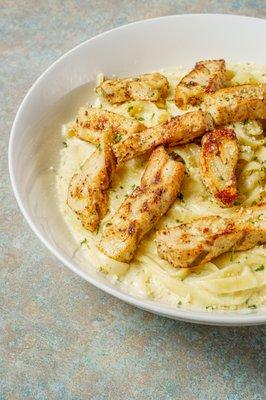 Fettuccini Noodles with Anthony's House Alfredo Sauce. Grilled Chicken.