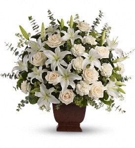 i ordered this arrangement BUT with color. Notice how many lilies are in the picture.