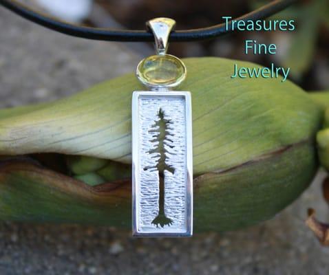 Custom hand cut sterling silver redwood pendant.