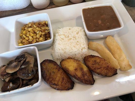 Vegan platter: mushrooms, corn, rice, pintos, yuca fries, plantains. So much goodness happening here.