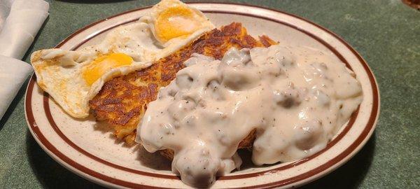 Biscuits and gravy and hash browns and eggs