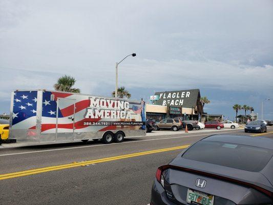 Our moving trucks stand out in a crowd, just like all of our movers do on moving day.