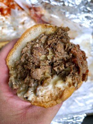 Cheesesteak with cooper sharp fried onions and ketchup Mayo