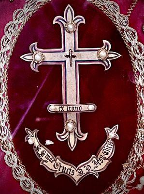 First class relic of the true cross kept behind the altar. You can bring your rosary or cross next to it and make yours a 3rd class relic.