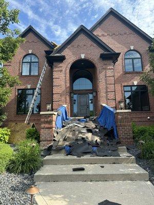 The tear off has begun today. There's a team of 8 guys working on my roof today.