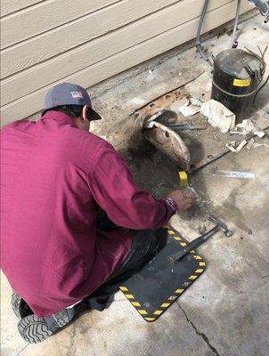 Brandon working hard on this as the company that laid the concrete, also concreted the unit in place.