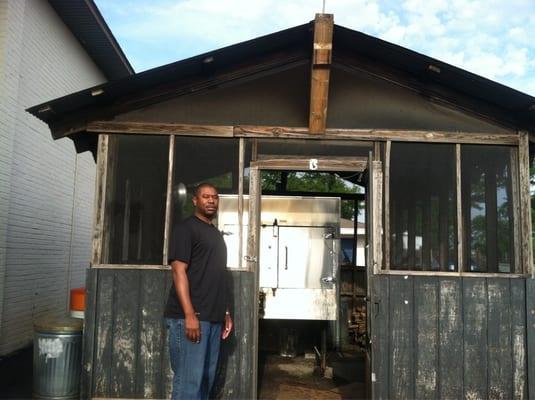 My boy Willie in front of the Smoker Shack where the magic happens (rib smoking magic)