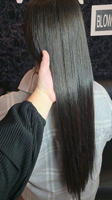 Sleek straight brazilian blowout on long curly hair