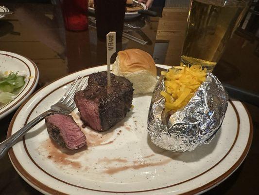 Filet mignon, loaded baked potato, dinner roll