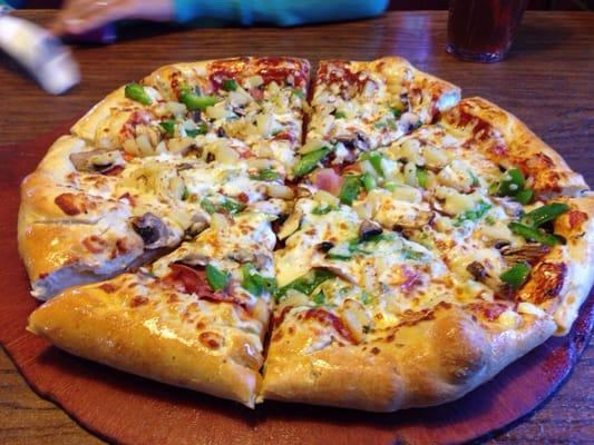 Pineapple , ham , cheese , pepperoni , mushroom and green peppers delicious.