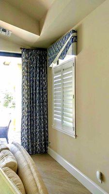 Cornice, plantation shutters, and custom curtains