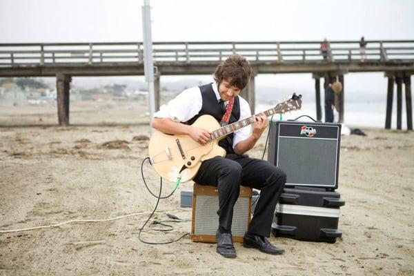 Nathan Towne performing at a beach wedding in Cayucos, CA