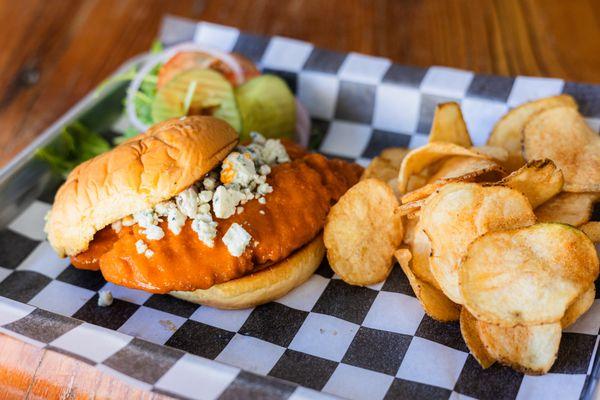 Hand breaded chicken tenders tossed in buffalo sauce, topped w/crumbled bleu cheese, served with toppings on the side