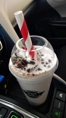 Giant paper straw, which makes drinking a milkshake with cookie pieces easier.