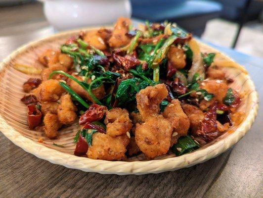 P8. Spicy Chongqing Chicken. $12. Diced fried chicken, dry stir-fried with chili peppers and numbing Szechuan peppercorns.