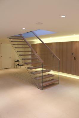 Structural glass stair with wooden treads.