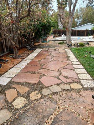 This is the completed work of where I laid flagstone. It is embedded in Lodi pea gravel.