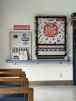 Old soap station, change machine out of order. BUT there is someone working here to provide change.