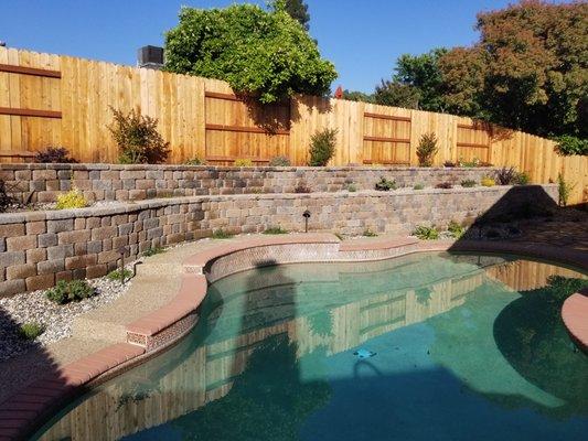 Complete backyard install with retaining walls and fences.  We were even able to gain the customer some space in the yard.