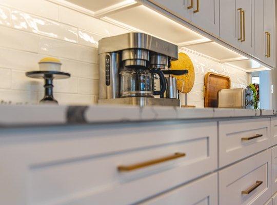 Kitchen remodeling project in Falls Church, VA with white kitchen countertop & wooden flooring