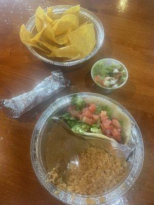 Kids meal beef soft taco, rice, refried beans with a tortilla included. Chips/guacamole.