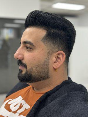 Client's haircut, hair styling, and beard shaping