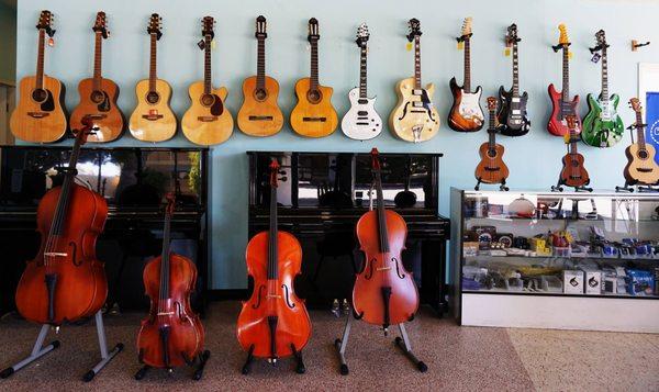 Our floor has upright pianos, guitars, cellos ready to be given a new home!