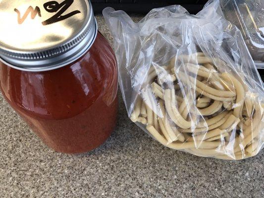 Homemade sauce bottled fresh and fresh unfrozen homemade fucilli.