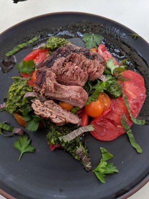 Steak with chimichurri and tomatoes