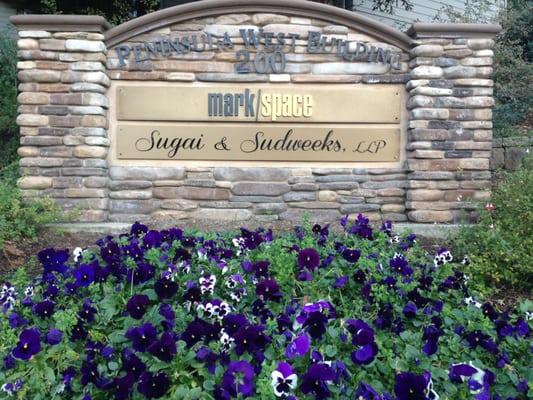 Sugai & Sudweeks, LLP Sign in front of building